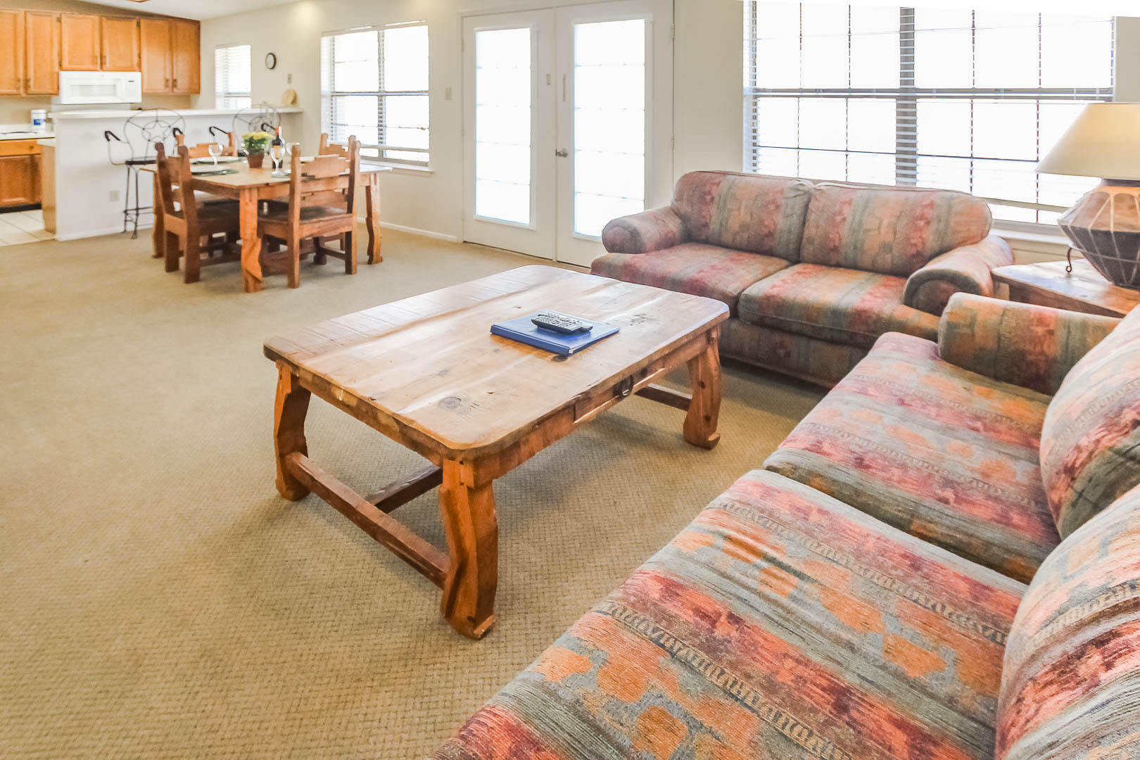 A spacious living room and kitchen  at VRI's Vacation Village at Lake Travis in Texas.